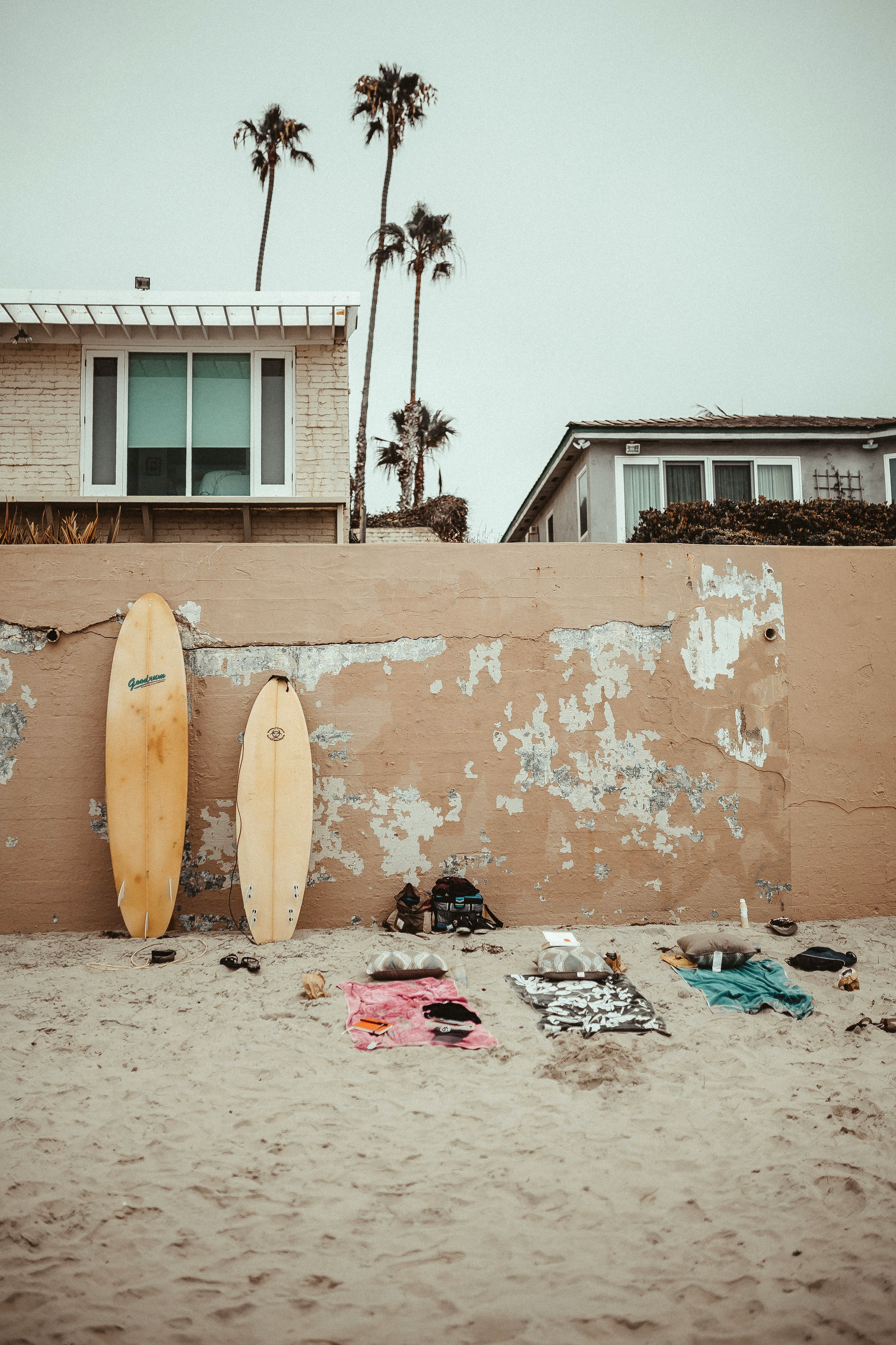 beige surfboards on the wall beside the beach